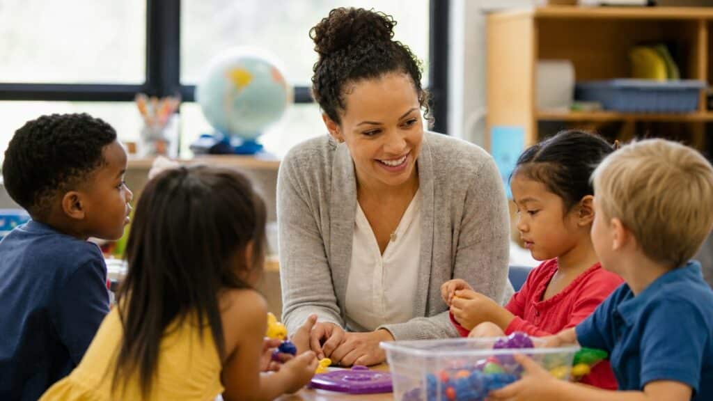 A teacher with young children, multilingual learners vs English learners